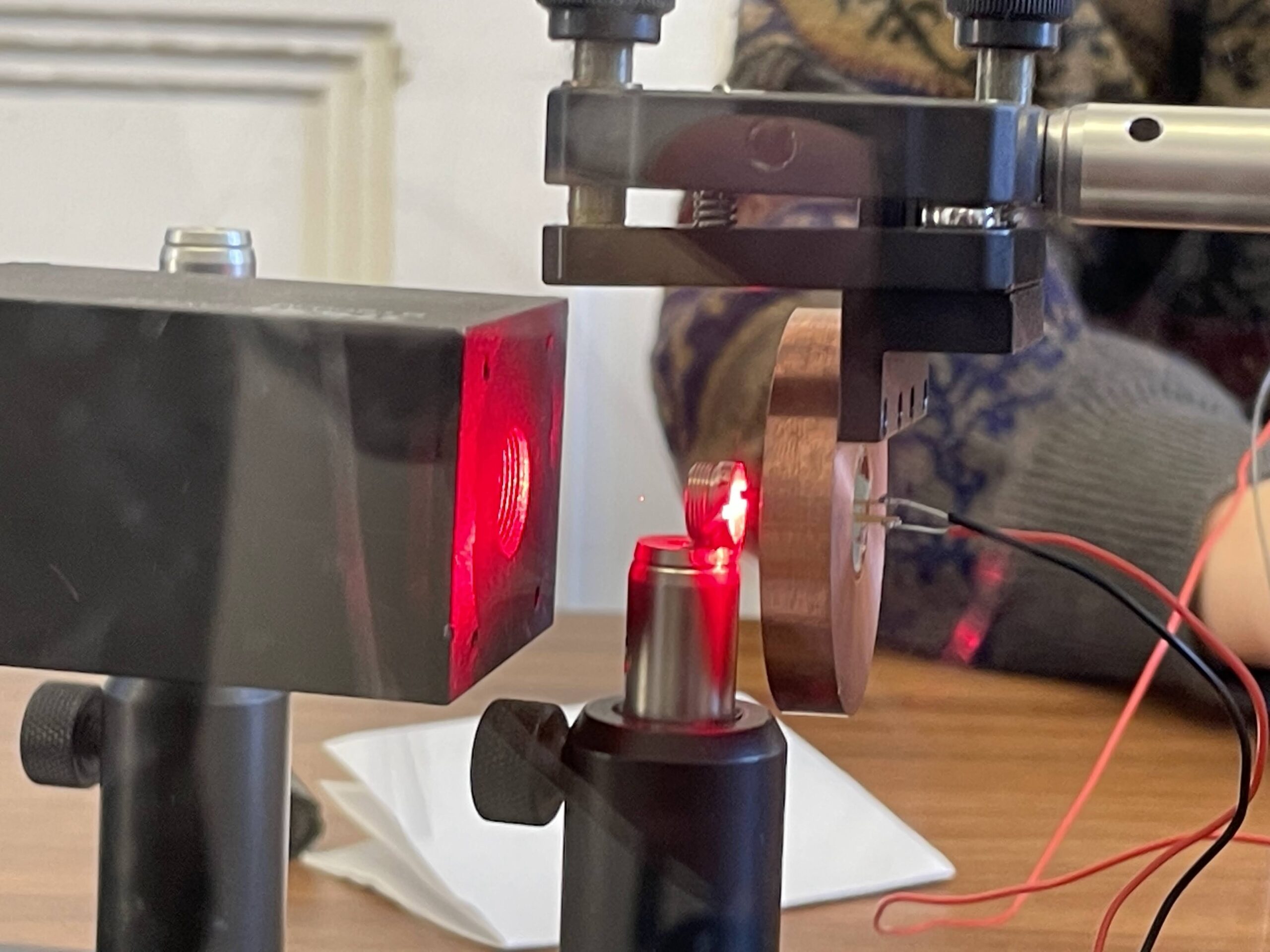An optical tweezer is easy to make. Just take a (big) laser pointer and a lens, and you can trap dust particles